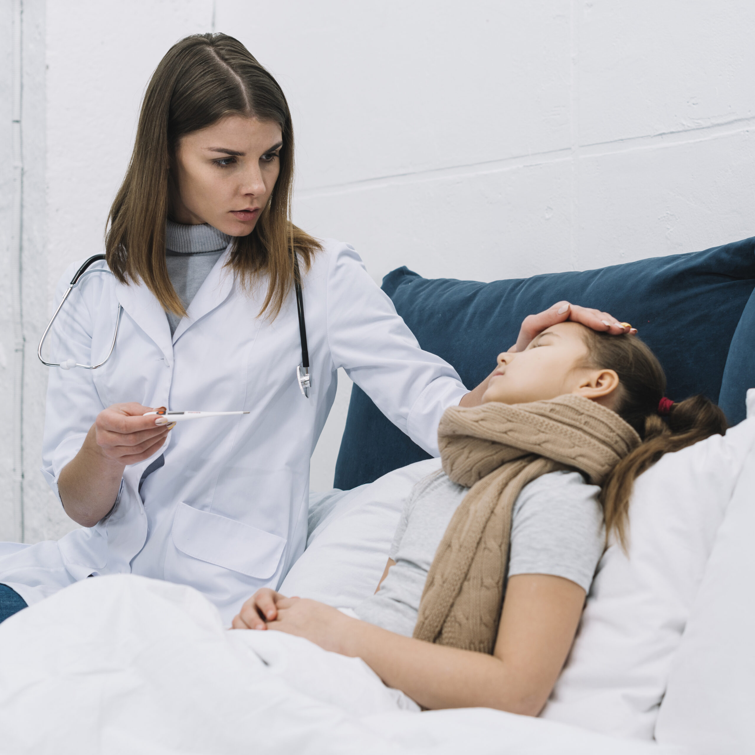 female-doctor-measuring-temperature-her-sick-patient-lying-bed